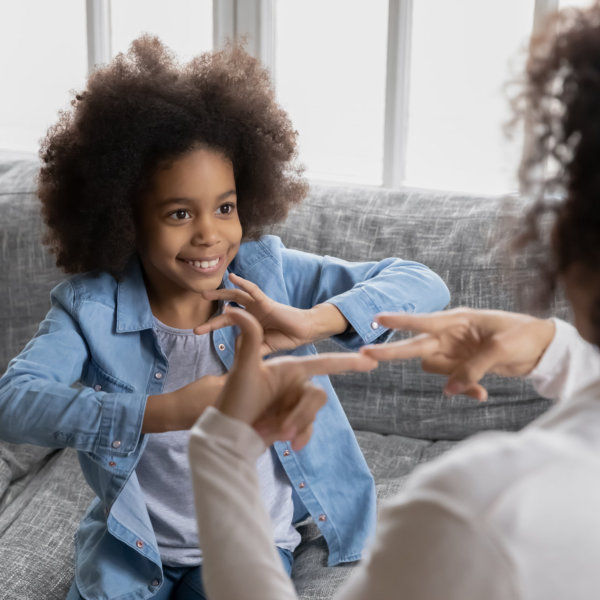 kid learning sign language